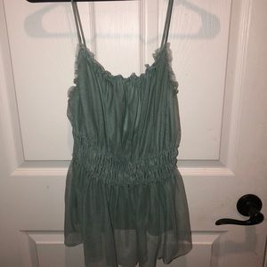 Aqua colored spaghetti strap shirt.